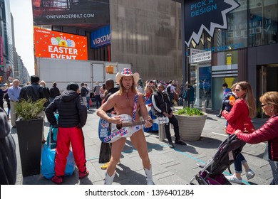 New York City, New York/ USA United States Of America - April 07 2019: Naked Cowboy, Famous NYC Street Performer On A Times Square Wearing Cowboy Boots, A Hat, White Briefs And Guitar. Editorial Use