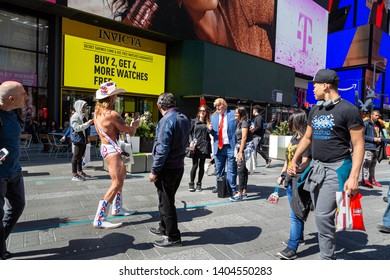 New York City, New York / USA United States - 04 07 2019: Naked Cowboy, Famous NYC Street Performer On A Times Square, Taking Picture Of President Donald Trump Artist. Editorial Use