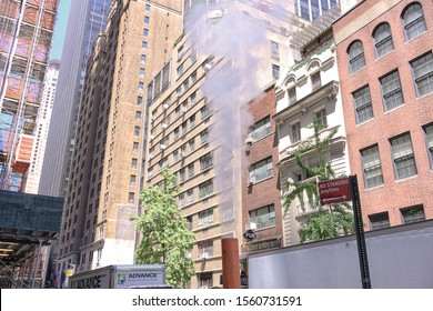 New York City, USA-May 18 2019. Black Poison Smoke Pipe Pooling Smoke Into The Air In The City Centre Of New York Street.