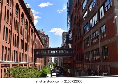 New York city view, beautiful view between 2 buildings with red bricks,  black bridge connecting 2 buildings in New york city