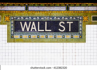 New York City Wall Street subway station with mosaic plate sign. New York City Downtown sign, financial district symbol, NYC, USA. Name tile pattern in subway station, Manhattan metropolitan.