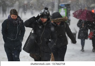 NEW YORK CITY - WINTER STORM 2014: People Fight The Winds But Are Stilled Plugged In, During A Winter Storm In Manhattan. 