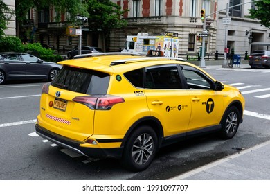 New York City Yellow Taxi Cab Toyota RAV4 Hybrid Vehicle. Rear Side View - New York, USA - 2021