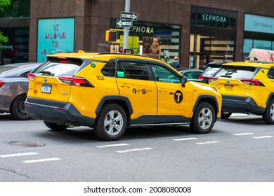 New York City Yellow Taxi Cab Toyota RAV4 Hybrid Vehicles On City Street. Rear And Side View - Manhattan, New York, USA - 2021