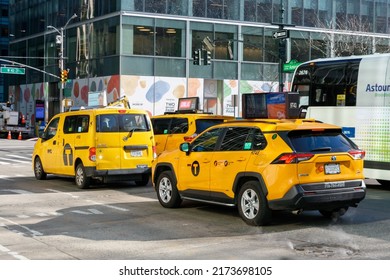 New York City Yellow Taxi Cab Vehicles On City Street. Rear And Side View - Manhattan, New York, USA - 2022