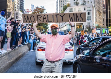 New York City, New York/USA November 7, 2020. Thousands Celebrate Joe Biden Defeating Donald Trump In The Presidential Election  And Kamala Harris The First Woman Vice President Of The United States. 