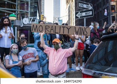 New York City, New York/USA November 7, 2020. Thousands Celebrate Joe Biden Defeating Donald Trump In The Presidential Election  And Kamala Harris The First Woman Vice President Of The United States. 