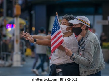 New York City, New York/USA November 7, 2020. Thousands Celebrate Joe Biden Defeating Donald Trump In The Presidential Election  And Kamala Harris The First Woman Vice President Of The United States. 