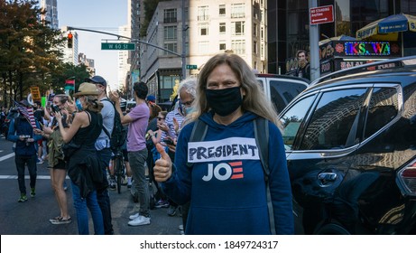 New York City, New York/USA November 7, 2020. Thousands Celebrate Joe Biden Defeating Donald Trump In The Presidential Election  And Kamala Harris The First Woman Vice President Of The United States. 