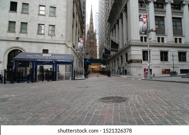 New York City/USA - September 2, 2019: Ground Level Vintage Brick Road View Of Stone Age Church In Iconic Location In Lower Manhattan Next To The NYSE.