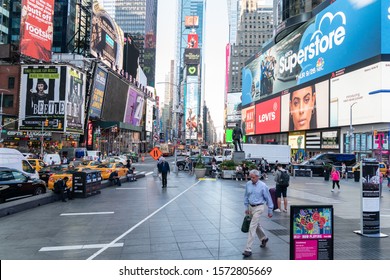New York City/USA - September 2, 2019: Street Level View Of Times Square With Large Billboard Screens And Ad Signs. Pre Rush Hour New York Scene With Plenty Of Space On Pavement To Put Text.