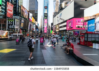 New York City/USA - September 2, 2019: The Site Of The New Years Eve Ball Drop In Times Square With Large Screen Billboards And Sightseeing Tourists.