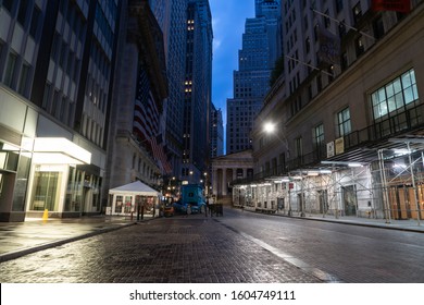 New York City/USA - September 2, 2019: The Dark Alley Of Wall Street With Federal Hall In The Distant Background.