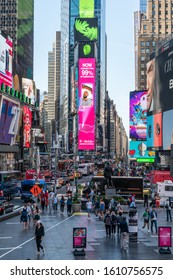 New York City/USA - September 2, 2019: Vertical View Of The Hustle And Bustle Of Times Square With Neon Ad Screens And Billboards.