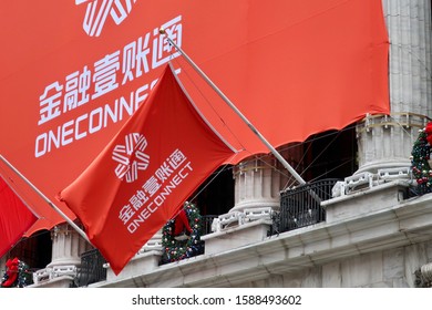 NEW YORK - DECEMBER 13, 2019: ONECONNECT Flag And Banner With Brand Logo Sign On Exterior Of NYSE Stock Exchange To Announce IPO OCFT Listing.