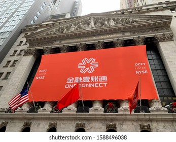 NEW YORK - DECEMBER 13, 2019: ONECONNECT Flag And Banner With Brand Logo Sign On Exterior Of NYSE Stock Exchange To Announce IPO OCFT Listing.