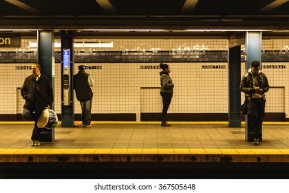 NEW YORK - December 21, 2015: Subway Train Broadway Station Platform With People Traveling In New York. The NYC Subway Is A Rapid Transit/transportation System In The City Of NY.