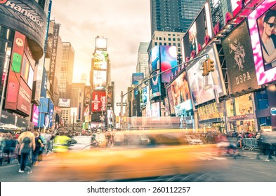 NEW YORK - DECEMBER 22, 2014: Blurred Yellow Taxi Cab And Rush Hour Congestion At Times Square In Manhattan, One Of The Most Visited Tourist Attractions In The World. Warm Vintage Filtered Editing.