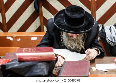NEW YORK - DECEMBER 26: Ultra Orthodox Jewish man studying scriptures in the famous 770 Chabad Lubavitch headquarter and home to last Chabad leader Menachem Mendel Schneerson on December 26 2014