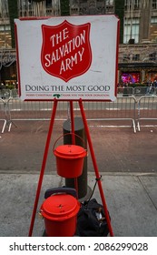 NEW YORK - DECEMBER 5, 2021: Salvation Army Sign And Red Kettle For Collections In Midtown Manhattan. This Christian Organization Is Known For Its Charity Work, Operating In 126 Countries