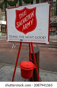 NEW YORK - DECEMBER 5, 2021: Salvation Army Sign And Red Kettle For Collections In Midtown Manhattan. This Christian Organization Is Known For Its Charity Work, Operating In 126 Countries