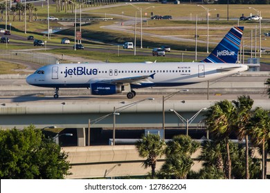 NEW YORK - DECEMBER 9: Airbus A320 JetBlue approaching JFK in New York USA on December 9, 2012 The A320 was the first narrow body airliner from Airbus It is the biggest competition to Boeing 737NG