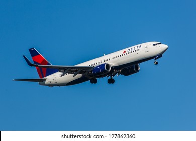 NEW YORK - DECEMBER 9: Delta Boeing 737 climbs after take off from JFK in New York USA on DECEMBER 9 2012 Delta is one of the biggest airlines in the world serve over 300 destinations around the world