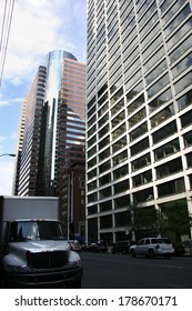 New York Delivery Truck By A City Street Scene With The Skycrapers At Bottom