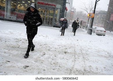 NEW YORK - FEB 9: Pedestrians Walk Along Astor Place As Snow Falls On February 9, 2017 In New York. Snowfall Totals Of Approximately Six Inches Fell In And Around NYC.