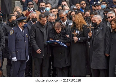 NEW YORK, NEW YORK - FEBRUARY 02, 2022: Amalia Mora, Mother Of Fallen Police Officer Wilbert Mora, Holds The Flag From His Casket During His Funeral At St. Patrick's Cathedral.