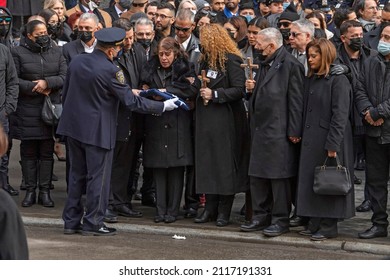 NEW YORK, NEW YORK - FEBRUARY 02, 2022: Amalia Mora, Mother Of Fallen Police Officer Wilbert Mora, Holds The Flag From His Casket During His Funeral At St. Patrick's Cathedral.