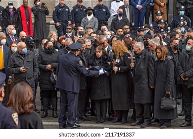 NEW YORK, NEW YORK - FEBRUARY 02, 2022: Amalia Mora, Mother Of Fallen Police Officer Wilbert Mora, Holds The Flag From His Casket During His Funeral At St. Patrick's Cathedral.