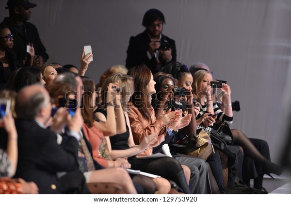 NEW YORK - FEBRUARY 15: People in front raw at the\
runway during Catalin Botezatu fashion show at The New Yorker Hotel\
during Couture Fashion Week on February 15, 2013 in New York\
City