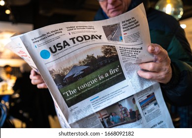 NEW YORK - FEBRUARY, 2020: Man Reading USA Today Newspaper.