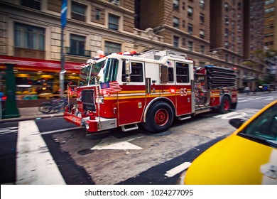 New York firefighter pumper truck responding to a emergency call in Manhattan downtown 