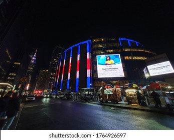 NEW YORK - JANUARY, 2020: Night Streetscene Of The Madison Square Garden And The Empire State Building In NYC.