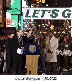 NEW YORK - JANUARY 21: (L-R) Michael Kay Mike, Tannenbaum, Leon Washington, And Curtis Martin At The New York Jets AFC Championship Game Pep Rally In Times Square On January 21, 2010 In New York City.