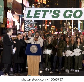 NEW YORK - JANUARY 21: (L-R) Michael Kay Mike, Tannenbaum, Leon Washington, And Curtis Martin At The New York Jets AFC Championship Game Pep Rally In Times Square On January 21, 2010 In New York City.