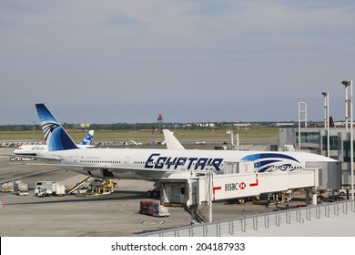 NEW YORK- JULY 10: EgyptAir Boeing 777 aircraft at the gate at John F Kennedy International Airport on July 10, 2014. EgyptAir is the flag carrier airline of Egypt based at Cairo International Airport
