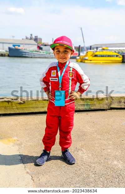NEW\
YORK - JULY 14, 2019: Young racing fan wearing racing suit during\
2019 New York City E-Prix at Red Hook in\
Brooklyn