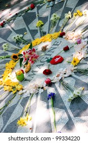 NEW YORK - JULY 17: John Lennon's Memorial At Central Park's Strawberry Fields On July 17, 2011 In New York. The Memorial Was Dedicated On What Would Have Been Lennon's 45th Birthday, 9 October 1985.