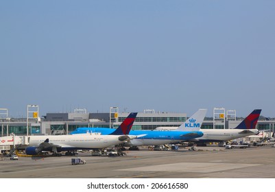 NEW YORK- JULY 22:  KLM Boeing 747, Delta Airline Boeing 747 and Airbus A330 at the gates at the Terminal 4 at John F Kennedy International Airport in New York on July 22, 2014