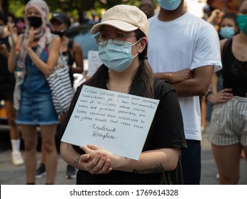 NEW YORK – July 4, 2020: A Demonstrator In New York City’s Columbus Circle Holds A Sign With A Quotation From A Frederick Douglass Speech.