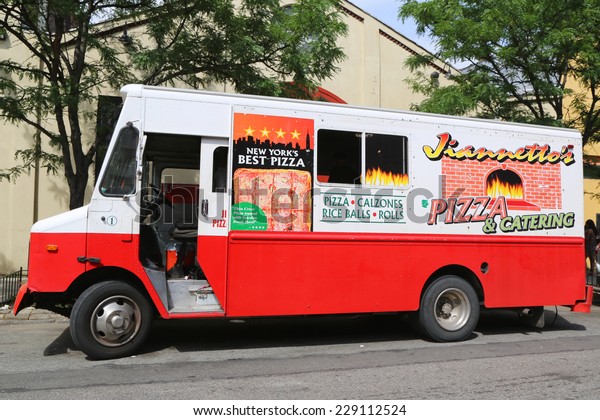 NEW\
YORK - JUNE 21: Jiannetto\'s Pizza Truck at East Williamsburg in\
Brooklyn on June 21, 2014. Jiannetto\'s Pizza Trucks serve an award\
winning Grandma Thin-Crust Sicilian Pie from\
1998