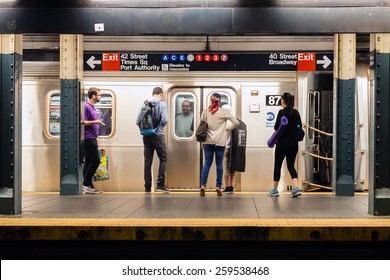 NEW YORK, NEW YORK - JUNE 28, 2013: MTA Subway Train Station Platform With People Traveling In New York On June 28, 2013. The NYC Subway System Is One Of The Oldest In The USA.