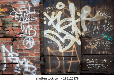 NEW YORK - JUNE 8: Graffiti On June 8, 2014 In New York. Graffiti Originating In The NYC Subway And Spread Beyond; It Is Both Vandalism And An Art Form.