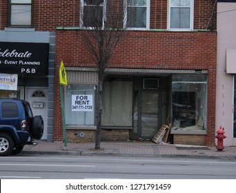 New York, Long Island USA-December 30, 2018 A For Rent Sign In The Window Of A Vacant Storefront