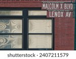 New York Malcom X Boulevard Lenox Avenue street sign in Harlem