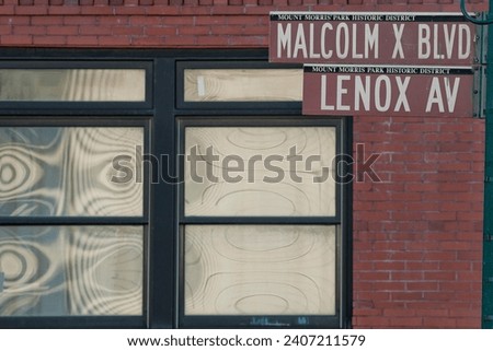 New York Malcom X Boulevard Lenox Avenue street sign in Harlem