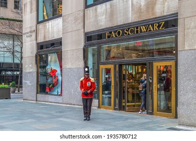 NEW YORK, MANHATTAN, USA - MARCH 6, 2020: Funny Man Dressed As A Butler In Front Of The F.A.O. SCHWARTZ In Rockefeller Plaza.